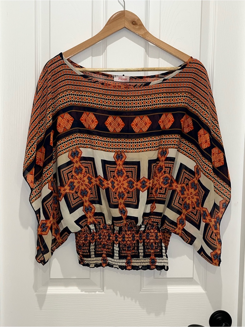 Vivace Orange Geometric Batwing Blouse with Smocked Waist